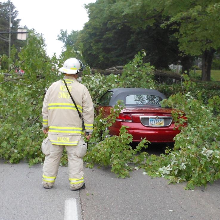 Fire Chief Examining Car
