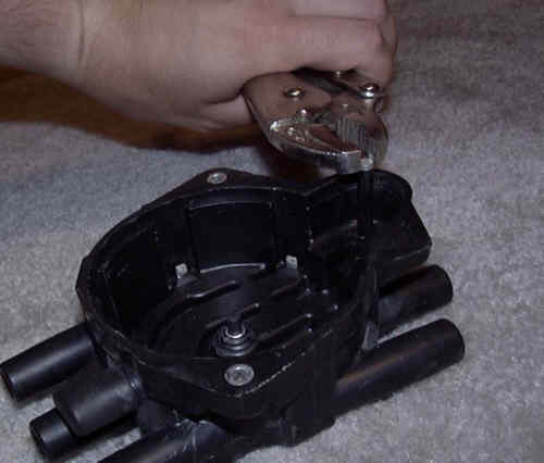 Figure 3: Removal of Stock Coil Electrode from Distributor Cap
