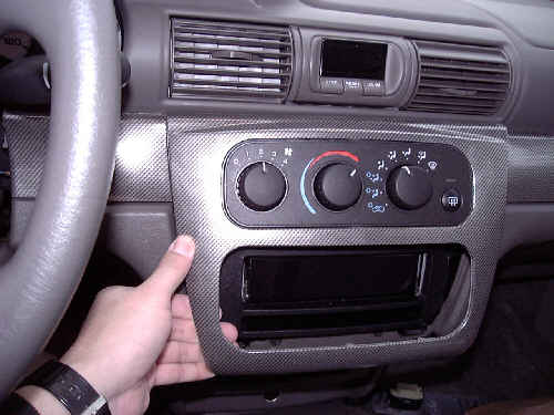 Instrument Panel Center Bezel Being Removed
